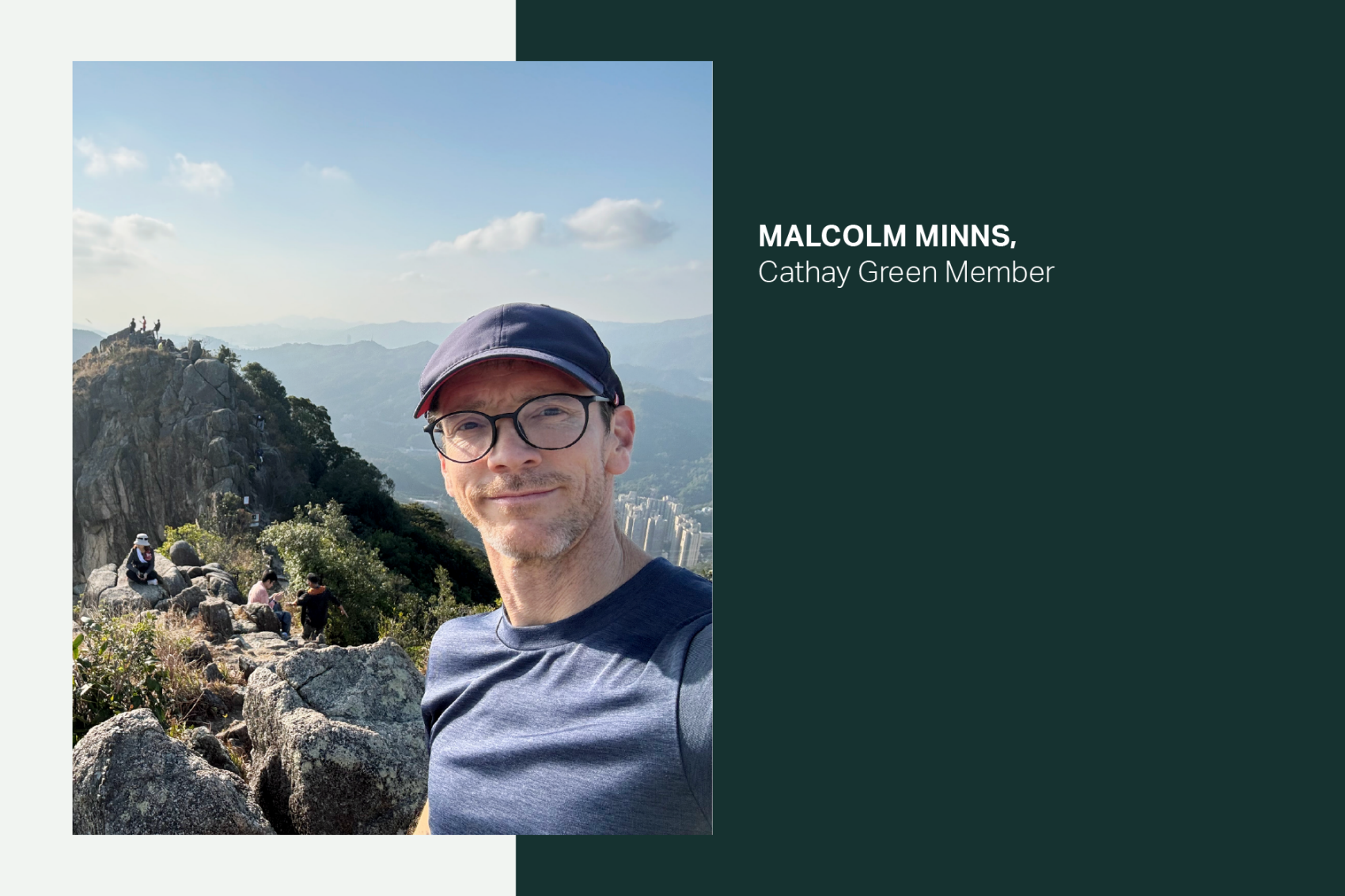 Malcolm Minns smiling on a hiking trail on a sunny day. 